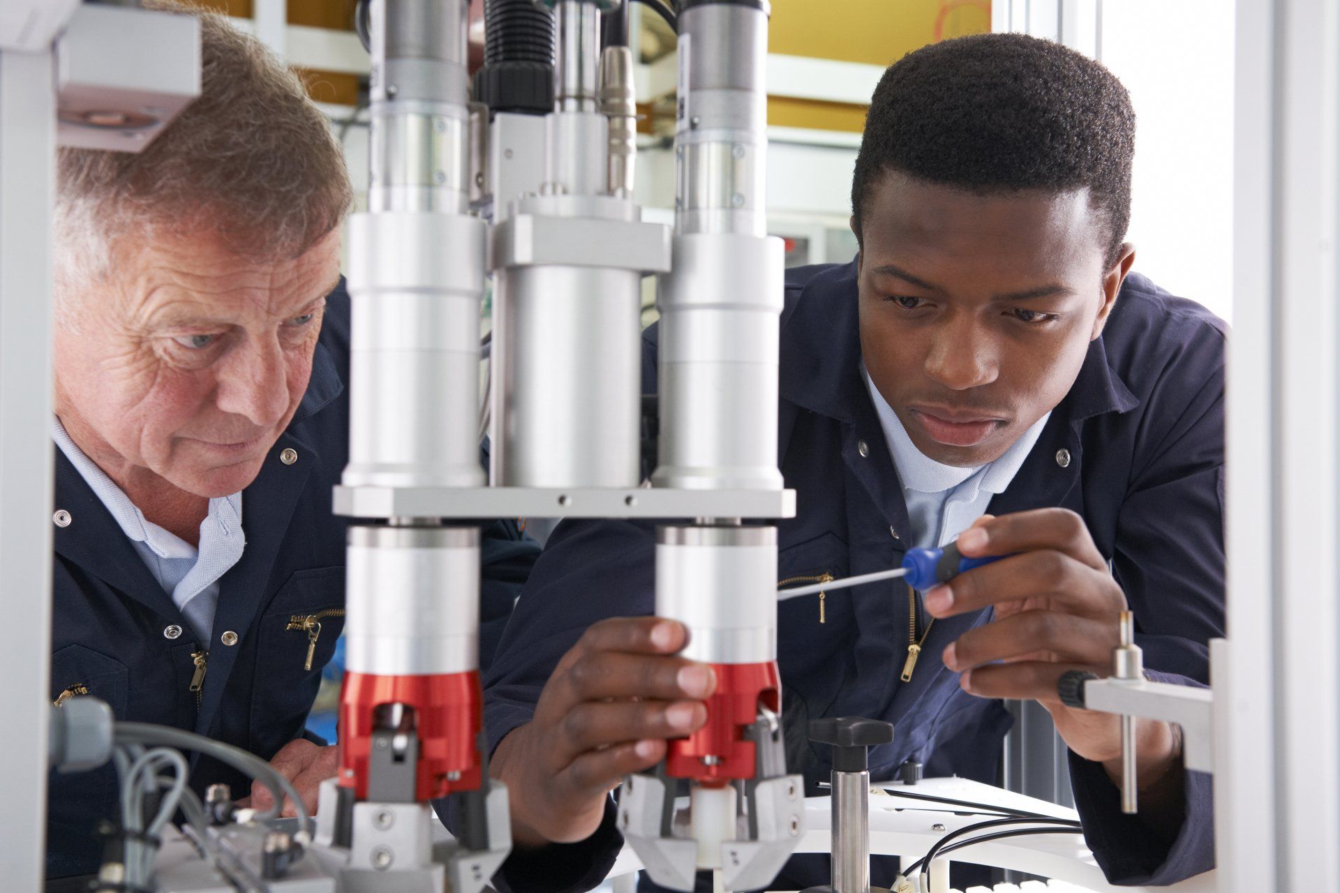 Two colleagues working on equipment